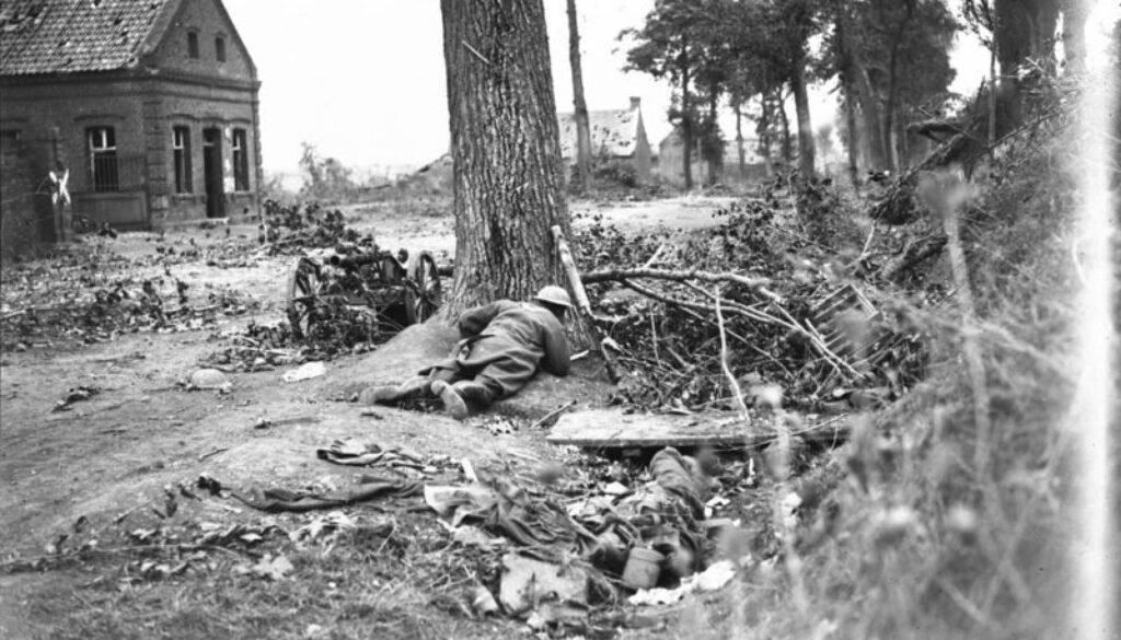 260_A Canadian soldier hidden behind a tree to avoid the sniper's bullets. Advance East of Arras. October, 1918